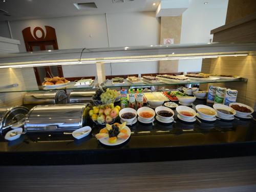 a buffet line with many different dishes of food at Samsun Airport Resort Hotel in Samsun