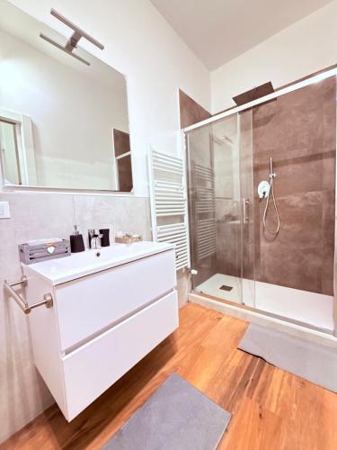 a bathroom with a white sink and a shower at Ama Esclusive Spa Firenze in Florence