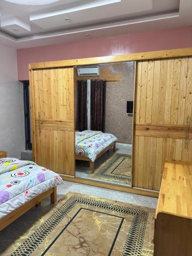 Llit o llits en una habitació de Résidence NDAR