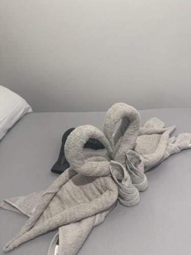 a towel sitting on top of a bed at Balham in London