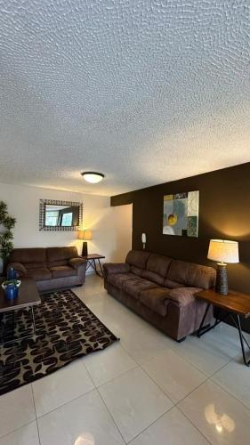 a living room with a couch and a table at Jaco Beach Penthouse in Jacó