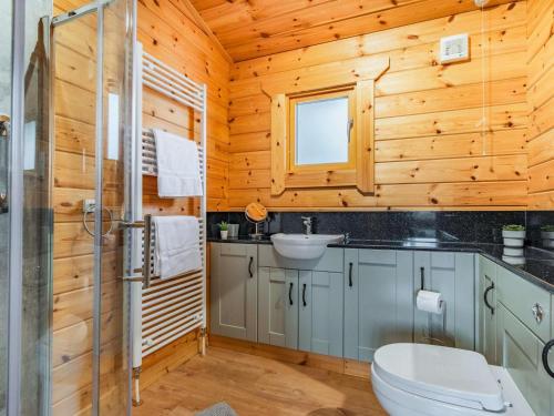 a bathroom with a toilet and a sink at 3 Bed in Maidstone oc-86252 in Lenham