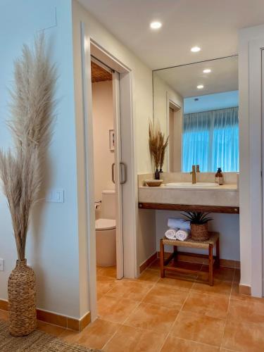 a bathroom with a sink and a mirror at Seren Casa Begur - Illa Roja Beach in Begur