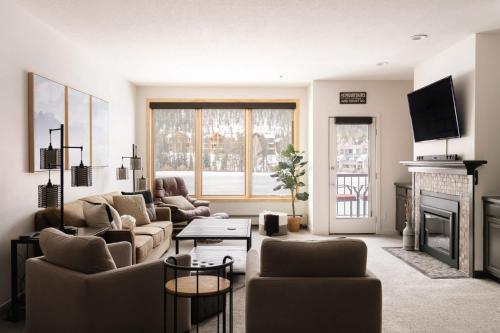 a living room with two couches and a fireplace at Lakefront Keystone Escape - Near Slopes & Trails in Keystone