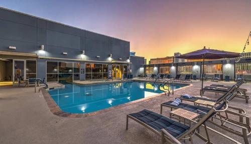 a large swimming pool with chairs in front of a building at The Platinum Hotel Las Vegas in Las Vegas