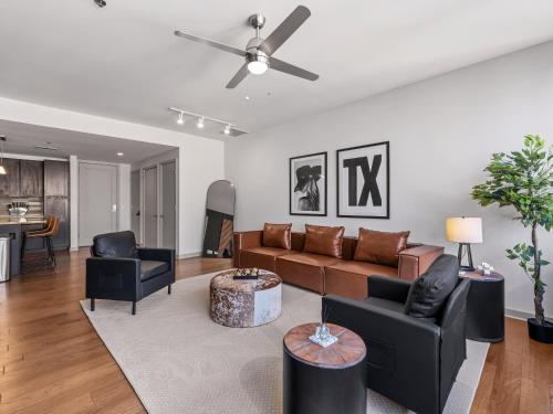 a living room with a couch and chairs at Luxury 17th Floor Downtown Dallas High-Rise with Free Parking, City Views, Pool & Gym in Dallas