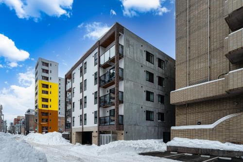 a building with snow in front of it at Zabo Hills 201 in Sapporo