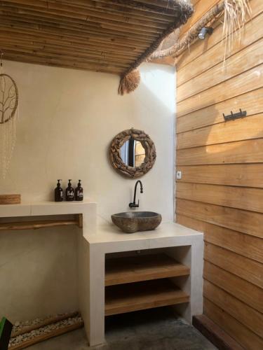 a bathroom with a sink and a mirror at La Bohème in Gili Islands