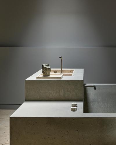 a concrete counter with a sink in a room at Bassano Red Hill in Red Hill