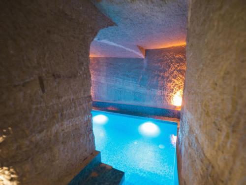 a view of a swimming pool in a building at My Cave Suites in Nevşehir