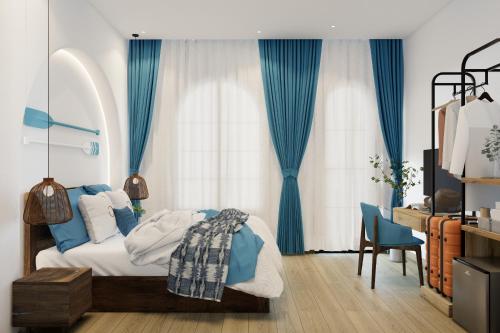 a bedroom with a bed with blue drapes at Hotel SHOL Ninh Chu in Thôn Nhơn Sơn