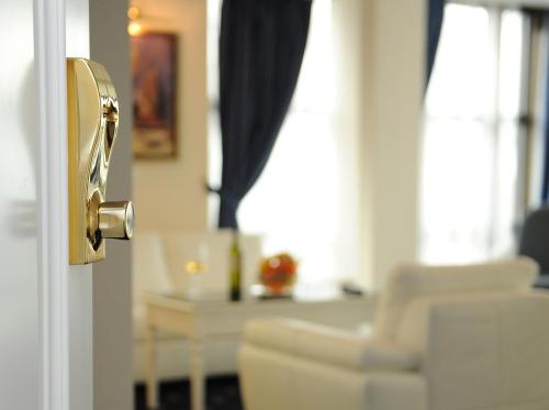 a door with a gold door knob in a living room at Millenium Palace in Ohrid