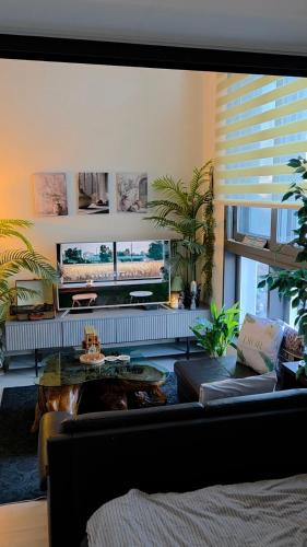 a living room with a couch and a table at La Casa Verde in Seoul
