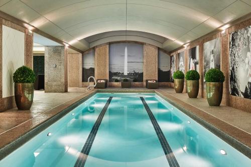 a large swimming pool in a hotel room at Four Seasons Washington DC in Washington
