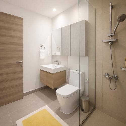 a bathroom with a toilet and a sink and a shower at Resort lifestyle, Fantastic Views, Bright & Brand new in Dubai