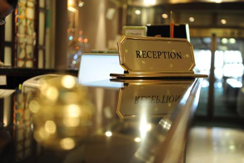 a gold trophy sitting on top of a table at Millenium Palace in Ohrid