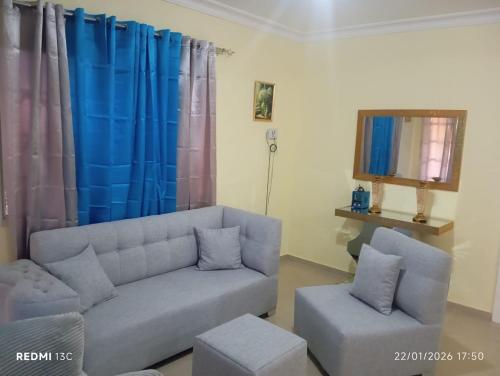 a living room with a couch and a chair at Casa vacanza, Mendosa in Bayaguana