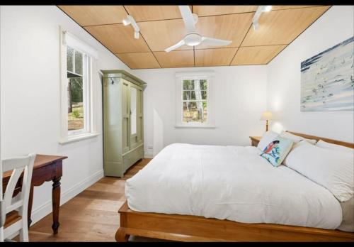 a bedroom with a bed and a ceiling fan at Amara Creek Retreat in Margaret River Town