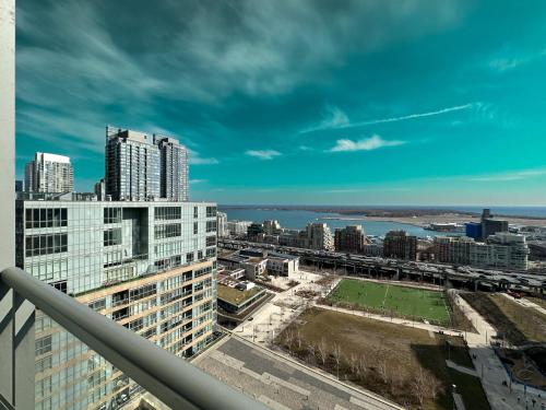 a view of the city from the balcony of a building at CityPlace Lofts Free Parking in Toronto