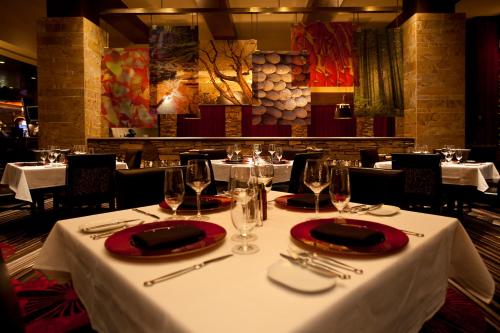 a table in a restaurant with white table cloth and wine glasses at Thunder Valley Casino Resort in Lincoln