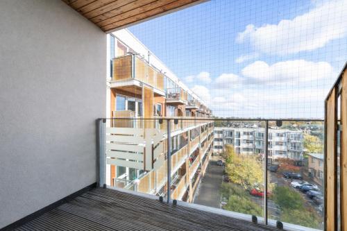 an apartment balcony with a view of a city at Spacious 2 Bed Apartment in Stratford in London