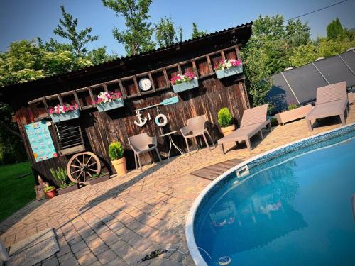 a backyard with a house and a swimming pool at Villa Stella in Prešov