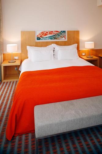 Ένα ή περισσότερα κρεβάτια σε δωμάτιο στο Hotel Praia