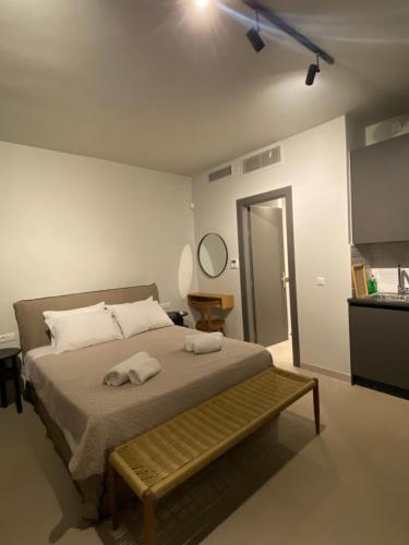 a bedroom with a bed with two towels on it at Aqua villa Studio II in Elafonisos
