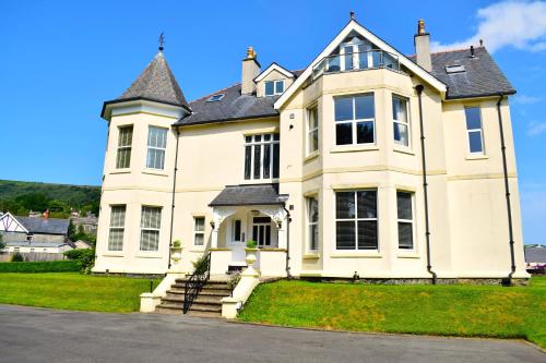 a large white house with a roof at Number 3 in Trefriw