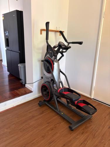 a stationary bike is parked in a room at Budget rooms in big house in Kelmscott