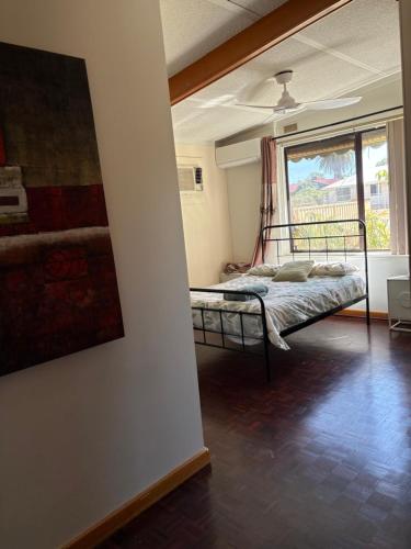 a bedroom with a bed and a large window at Budget rooms in big house in Kelmscott