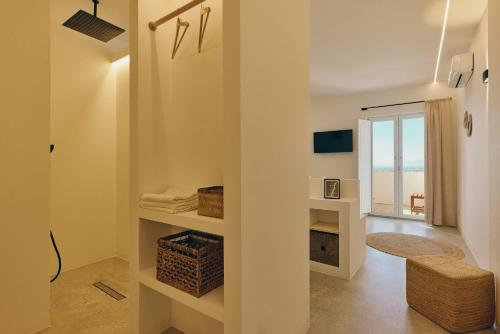 a white bathroom with a view of the ocean at Casa Nature Paestum in Capaccio-Paestum