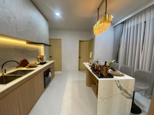 a kitchen with a sink and a counter top at The Casa Del Forest Ao-Nang in Ban Nong Thale