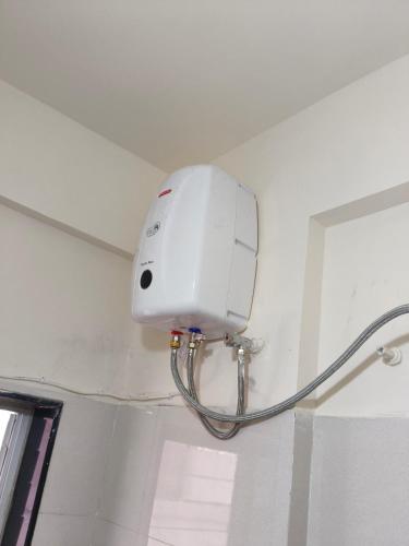 a white light on the ceiling of a bathroom at Prolife Tathwade in Méribel Village