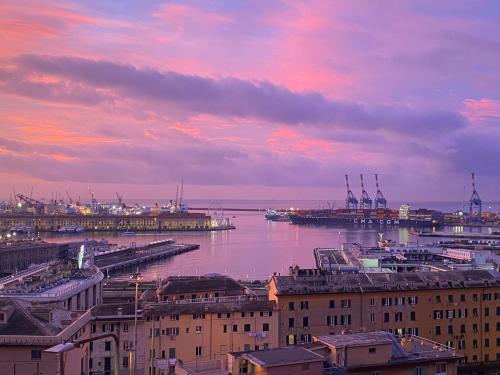 a view of a city with a harbor with buildings at B&B Luci del porto in Genoa