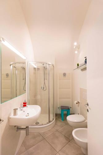 a bathroom with a shower and a sink and a toilet at CasaCirio Agriturismo in Rialto
