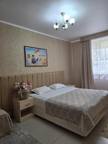 Postel nebo postele na pokoji v ubytování Gostinitsa Sultan