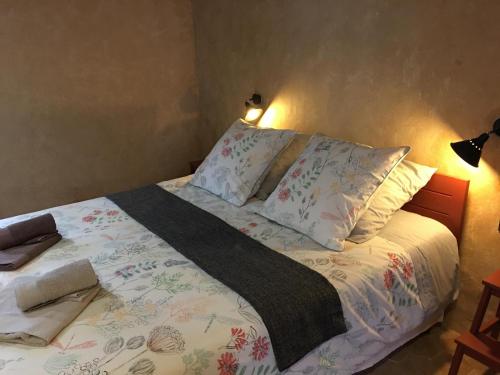 a bed in a bedroom with two pillows on it at Le refuge de théoline in Lathus St Remy