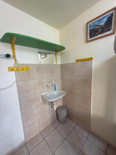 a bathroom with a sink and a toilet at The Shelter Hostel Eilat in Eilat