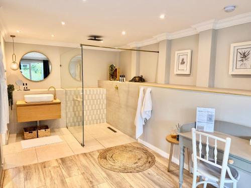 a bathroom with a shower and a sink at The Wesley Boutique Hotel & Spa in Johannesburg