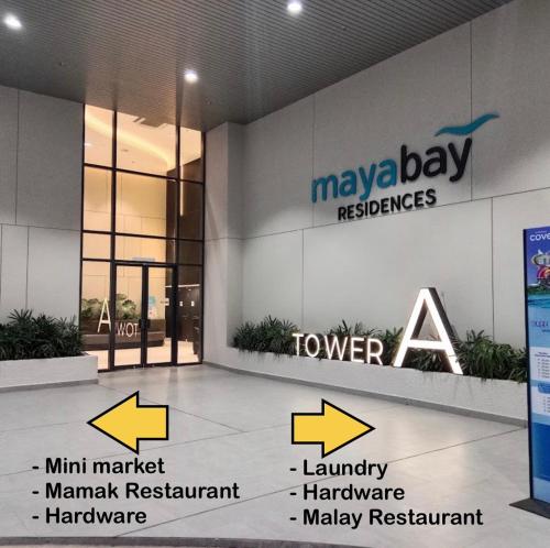 a building with arrows pointing to the names of mayday residences at La Dimora Gamuda Cove Splash Mania in Pulau Kempas