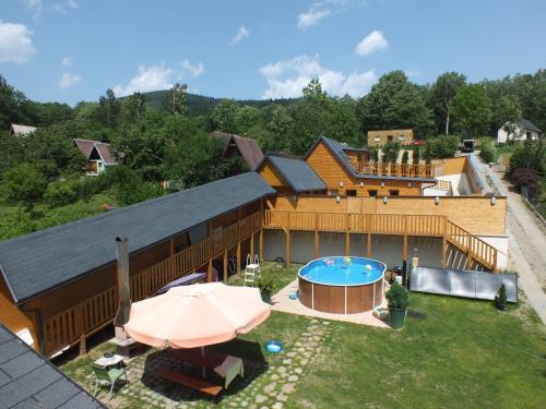 an overhead view of a house with a swimming pool at Chalets under Falcon Ridge in Česká Ves