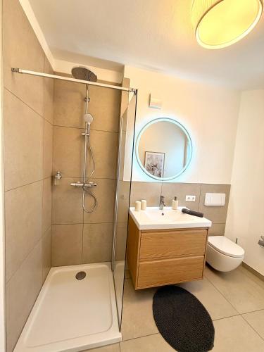 a bathroom with a shower and a sink and a toilet at Ferienhaus 1 Fuchsweg in Stralsund