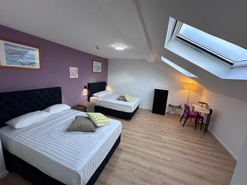 Postel nebo postele na pokoji v ubytování Hotel Albert