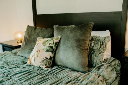 a bed with pillows on top of it at Kestrel lodge in Wrexham
