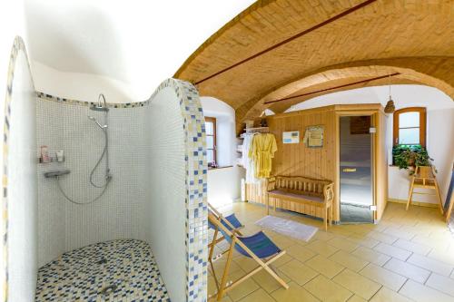 a large bathroom with a shower and a room at Buchgrabenhof in Windisch Minihof
