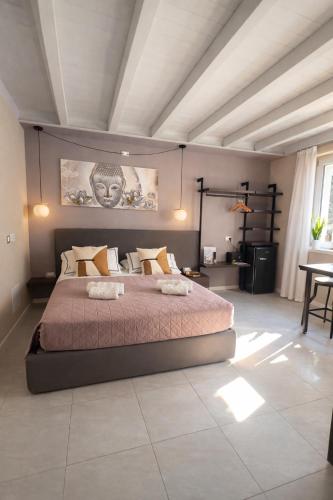 a bedroom with a large bed in a room at ES Apartments in Nago-Torbole