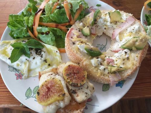 a plate of food with a sandwich and a salad at Stratos ArtDeco House in Kalavasos
