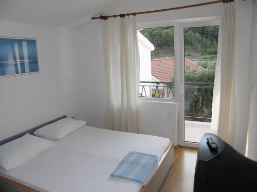Posteľ alebo postele v izbe v ubytovaní Guest House & Restaurant Adriatic Klek