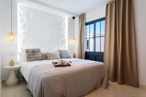 a bedroom with a large bed with a large window at Villa Zendaya in Yaiza
